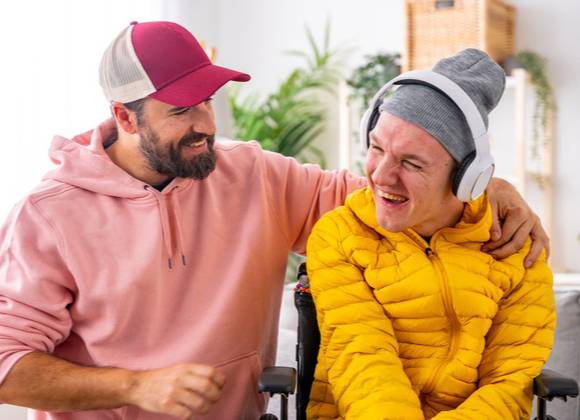 Carer interacting with young person with special educational needs.